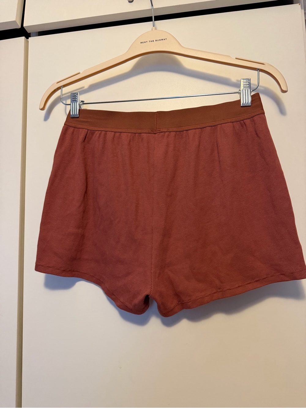 SKIMS Ribbed Athletic Shorts in Rust - Picture 3 of 3